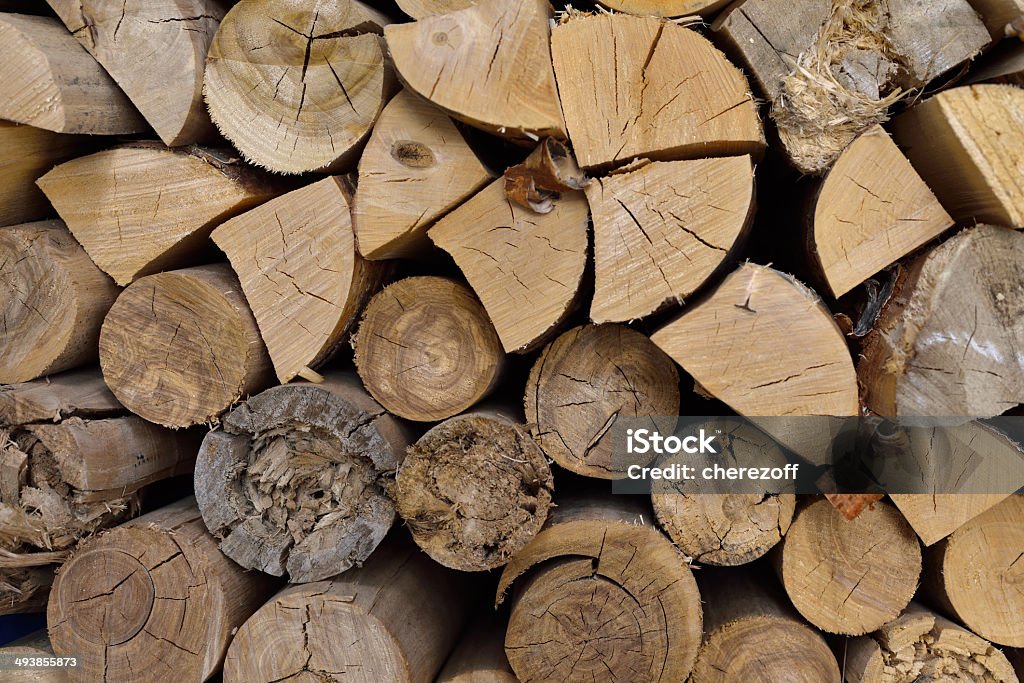 Wood chopped firewood stacked on the stack Wood chopped firewood stacked on the stack. Natural background Aging Process Stock Photo