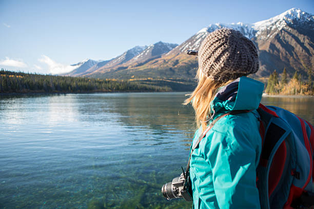 istock Tourist near lake in Canada looking at view 493857002