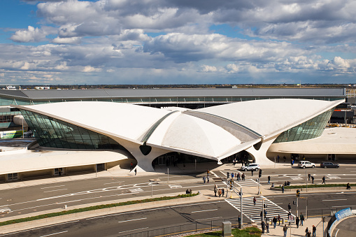 New York City, New York, USA - October 18, 2015: View of landmark TWA Flight Center at John F. Kennedy International Airport in Queens, New York, City.  Designed by Eero Saarinen and opened in 1962 this mid-century modern Flight Center is on the National Register of Historic Places