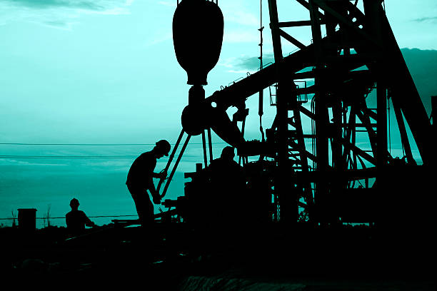 istock oil field, the oil workers are working 493858474