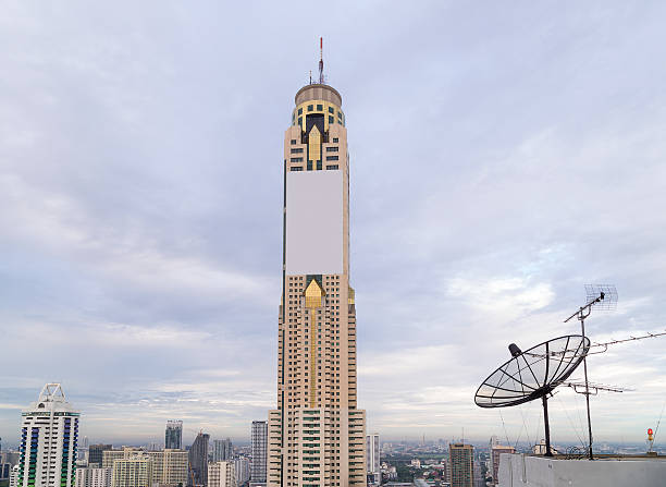 istock Satellite dish antenna on top of the building 493859420