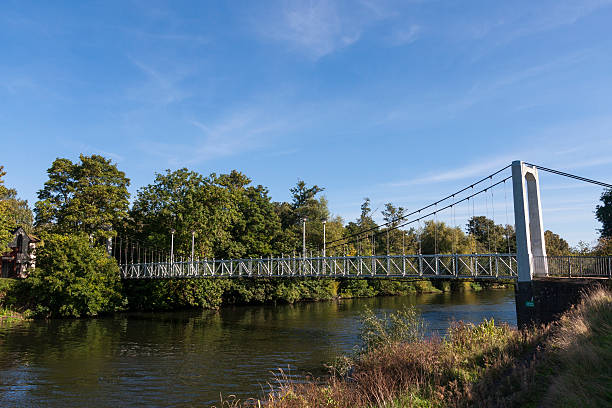 istock Pedestrian suspension bridge crossing the river Exe in Exeter 493861400