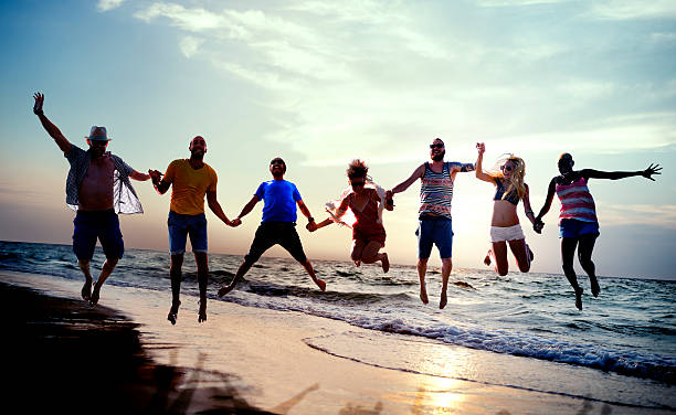 istock Diverse Beach Summer Friends Fun Jump Shot Concept 493862354