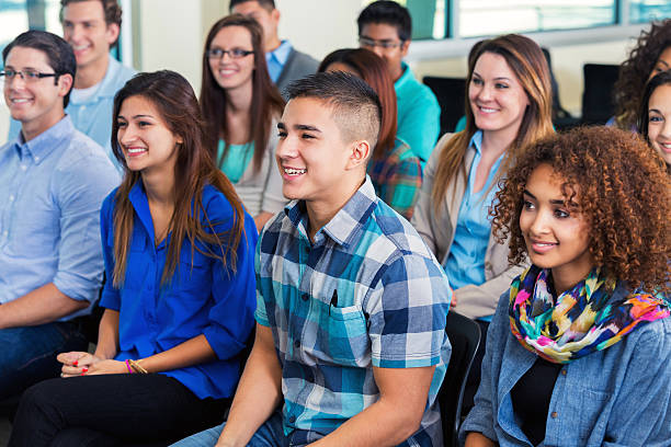 istock Diverse college students attending assembly or orientation meeting 493862508