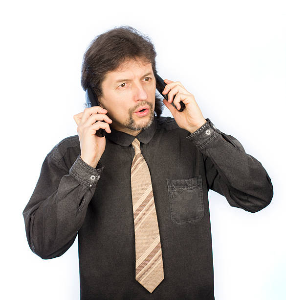 istock young man talking on the phone 493870504