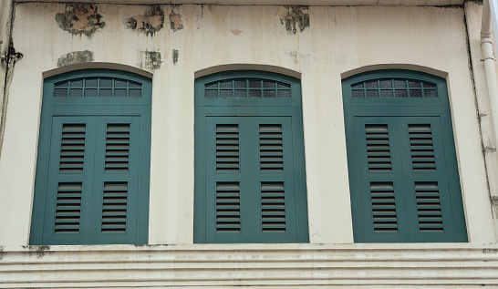 Vintage windows in Singapore. Traditional architecture in Singapore includes vernacular Malay houses.