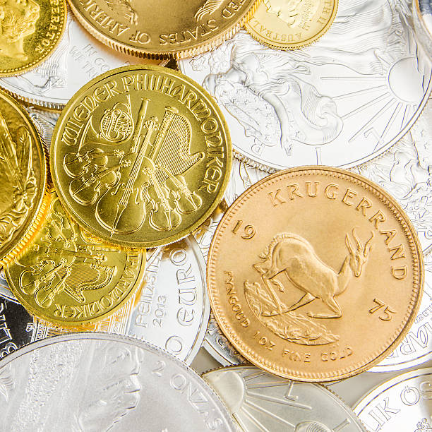 istock mixture of silver and golden coins 493876988
