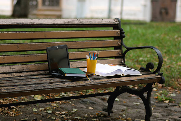 istock books on a bench in the school year 493878044