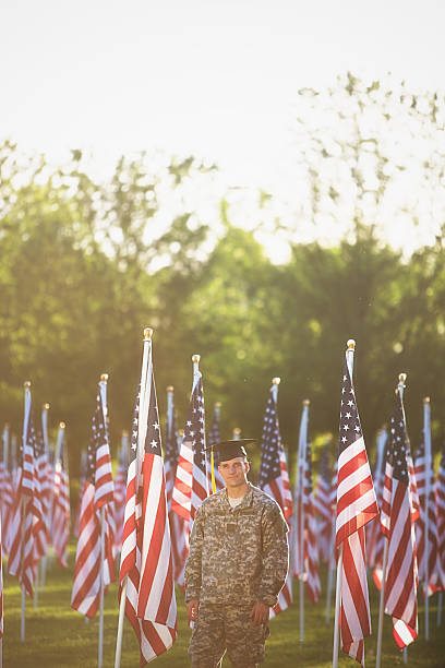 istock American Soldier with graduation hat 493883271