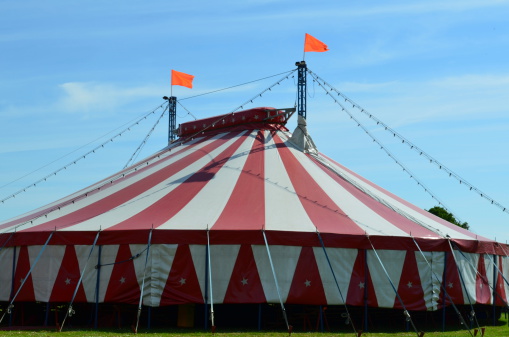 A circus is in town and the large canvas tent, or big top is erected ready for that evenings performance.
