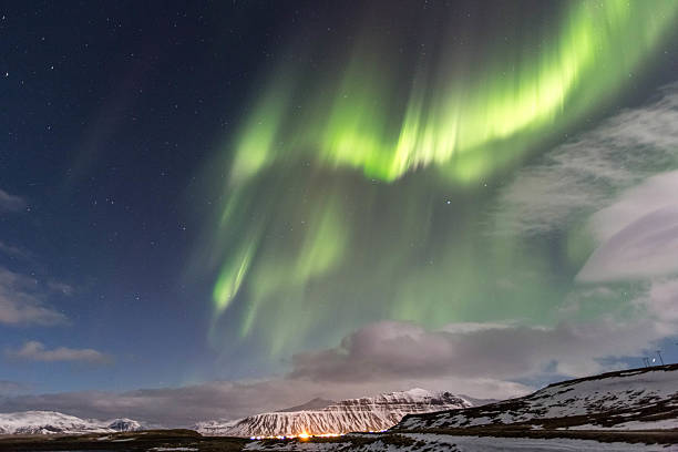 istock Northern Lights over town in Iceland 493884291