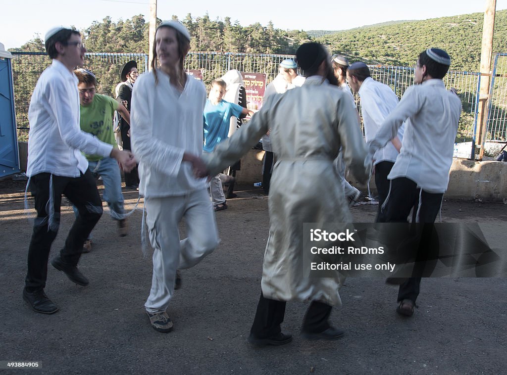 Lag BaOmer on Mount Meron Meron, Israel - May 18, 2014: Orthodox Jews dance at the annual hillulah of Rabbi Shimon Bar Yochai, in Meron, on Lag BaOmer Holiday. This is an annual celebration at the tomb of Rabbi Shimon Bible Stock Photo