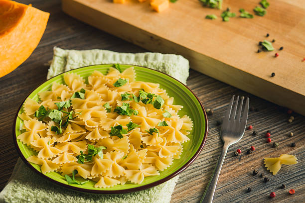 istock Pasta with pumpkin, herbs and pepper. 493885228