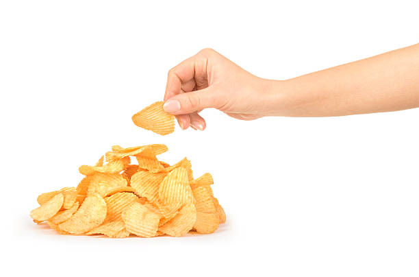 Pile of potato chips isolated on white Pile of potato chips isolated on white potato chip stock pictures, royalty-free photos & images