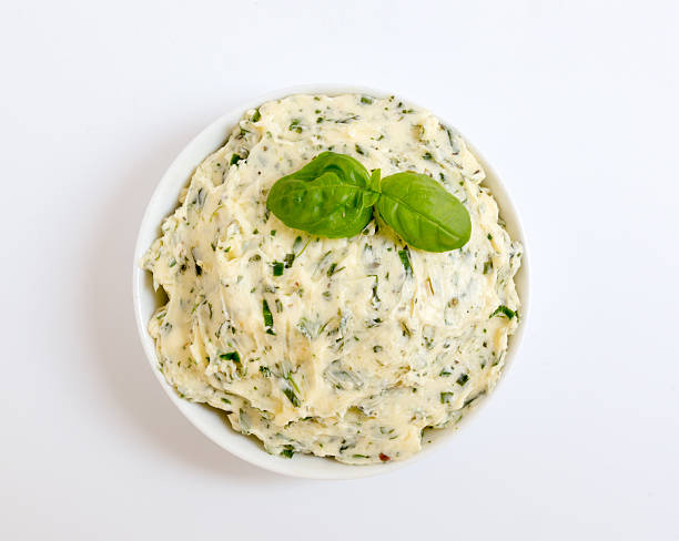 Herb butter in a bowl as a Cut.
