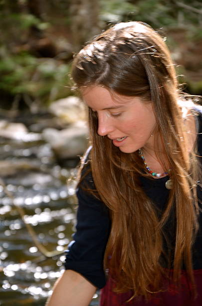 istock girl near the water 493886541