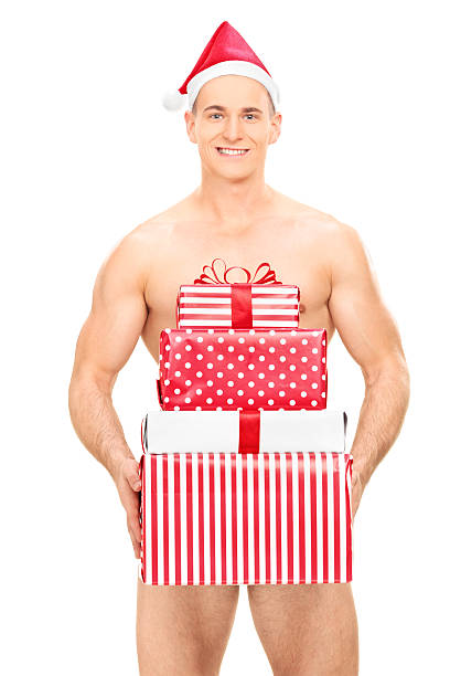 bello nudo uomo che tiene una pila di regali - christmas stack gift carrying foto e immagini stock