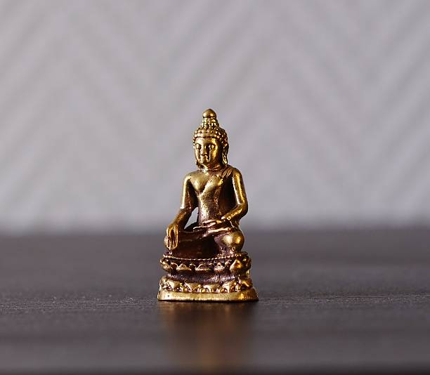 istock Bronze statue of a Buddha 493889826
