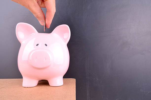 istock Saving money in a piggybank 493889978