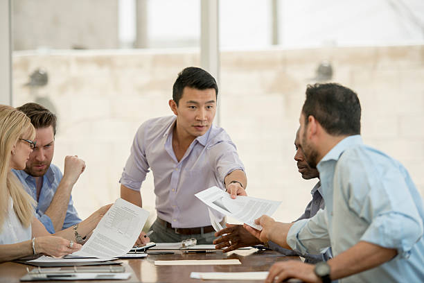 istock Looking Over Financial Date in the Boardroom 493892404