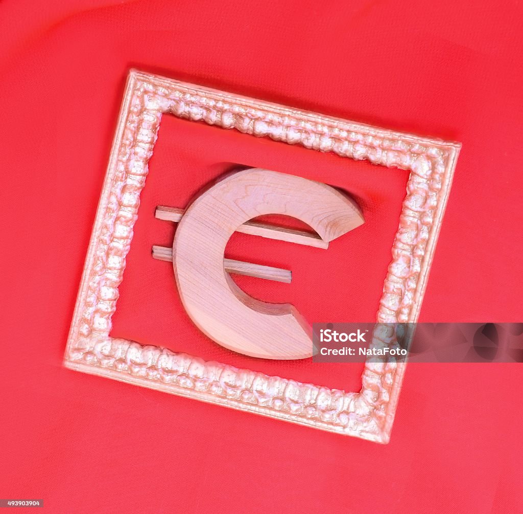 Wooden symbol of the Euro in a festive gold frame Banking concept profit 2015 Stock Photo
