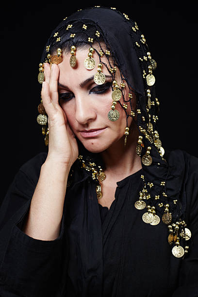 istock Beautiful middle eastern muslim woman lost in thoughts 493904414