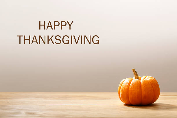 istock Thanksgiving message with orange pumpkin 493907558