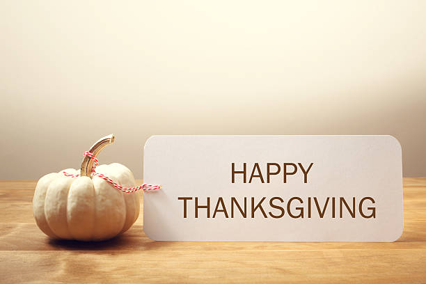 istock Happy Thanksgiving message with a white pumpkin 493907630