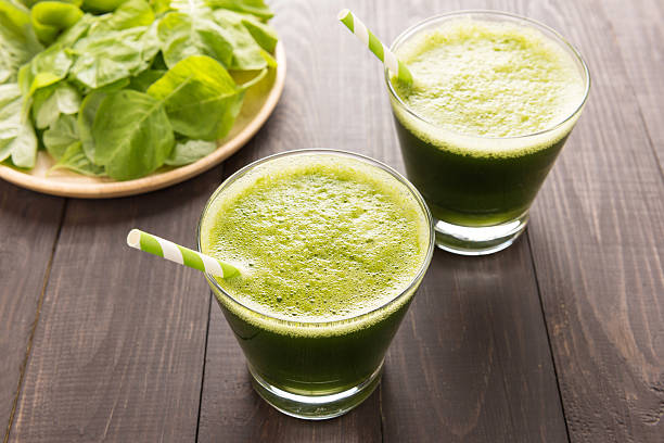 istock Healthy green smoothie on rustic wood background 493909954