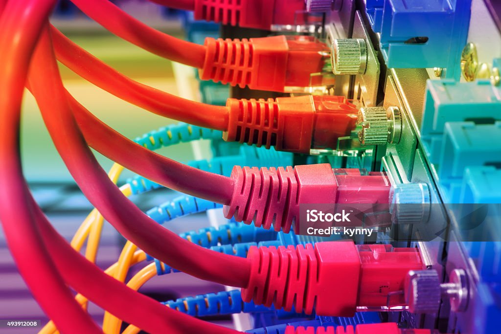 network cables connected to switch network cable with high tech technology color backgroundpatch network cables connected to switch 2015 Stock Photo