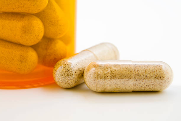 istock Medicine pill capsules with medicine bottle 493912356