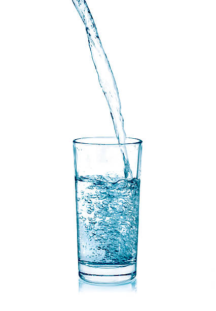 istock pouring water on a glass 493912412