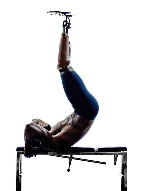 istock handicapped body builders building weights man with legs prosthesis 493914055
