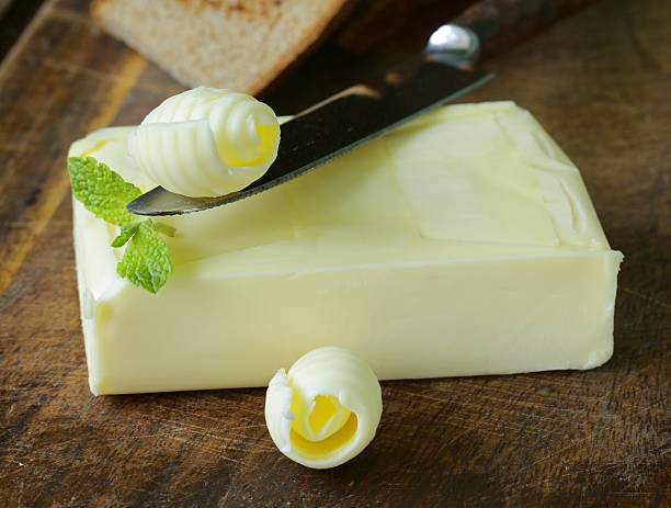 istock fresh yellow butter served on a wooden board 493914095
