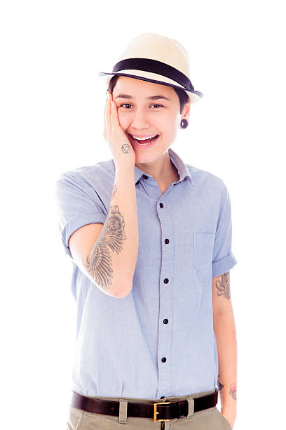istock Young woman smiling with her hand on cheek 493915221