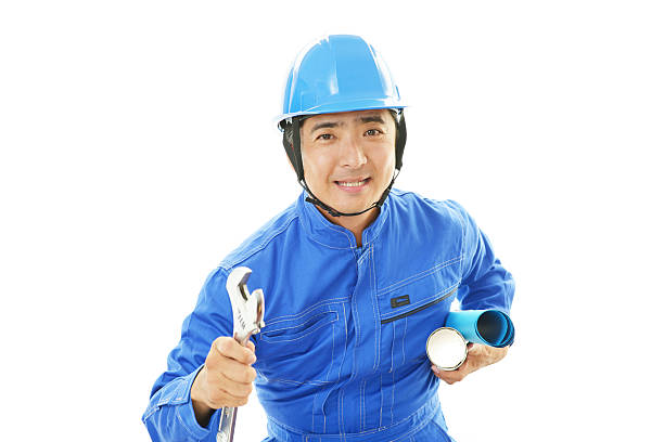 Smiling Asian worker isolated on white background