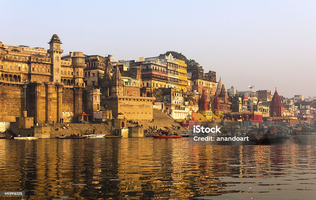 the city and ghats of Varanasi the city and the ghats of Varanasi in the early morning at sunrise. (all logos blurred) Varanasi Stock Photo