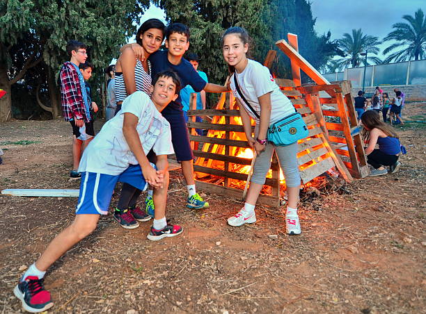 Tel Aviv, Israel - May 18, 2014: Secular Israeli Kids having fun at Lag BaOmer with bonfires and food