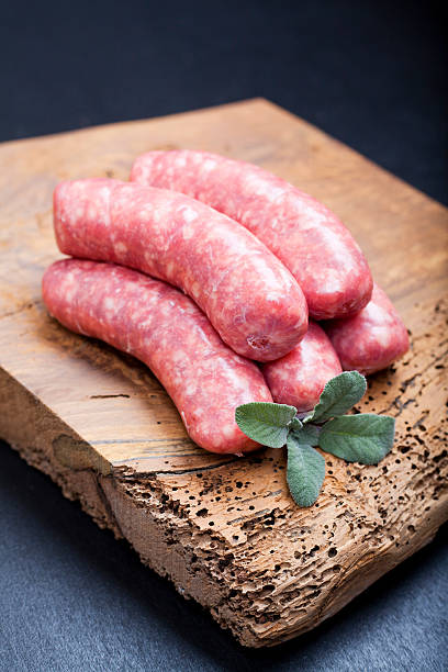 istock raw homemade sausage on a wooden board 493916949