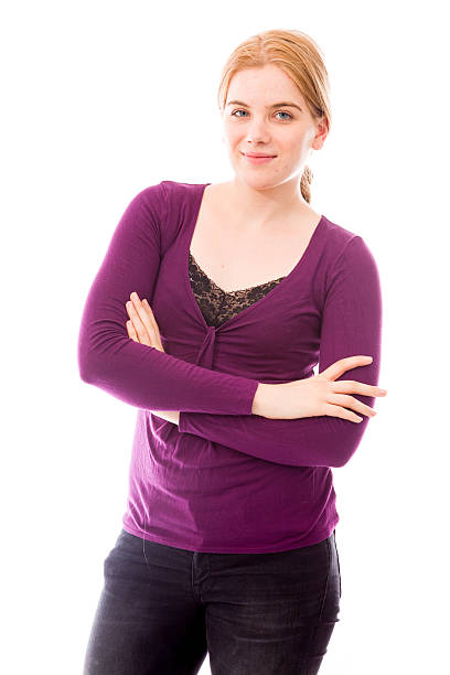 istock Young woman standing with her arms crossed 493917301