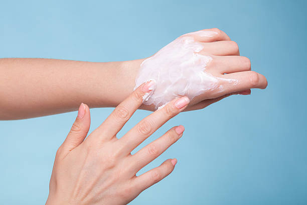 istock Skin care. Female palms with moisturizing cream. 493917823