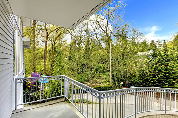 istock Front balcony house exterior with driveway view. 493918647