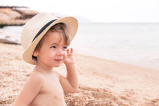 istock Portrait of caucasian baby at the beach. 493919829