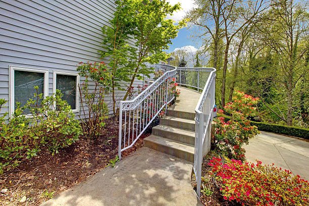 istock Large grey house exterior of modern home with walkway. 493919991