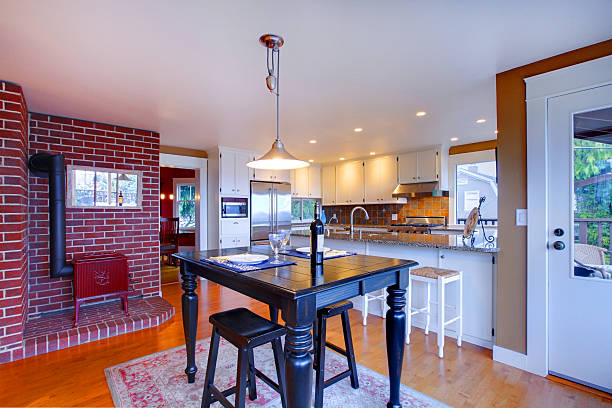 istock Luxury white kitchen with beautiful stove and black breakfast table 493920481
