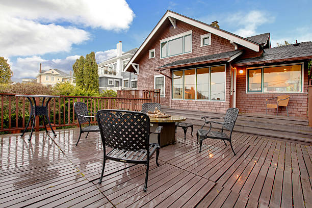 istock Large brown house with back deck exterior rain winter shot 493921267