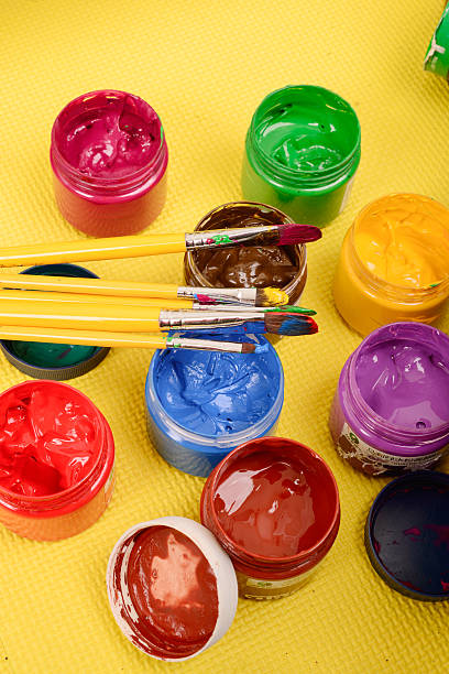 istock Colorful paints and artist brushes 493921399
