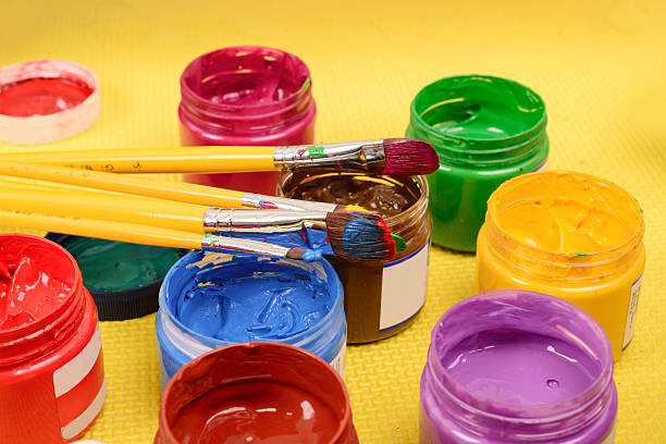 istock Colorful paints and artist brushes 493921401