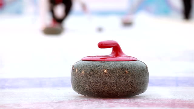 The stones for Curling on the ice.