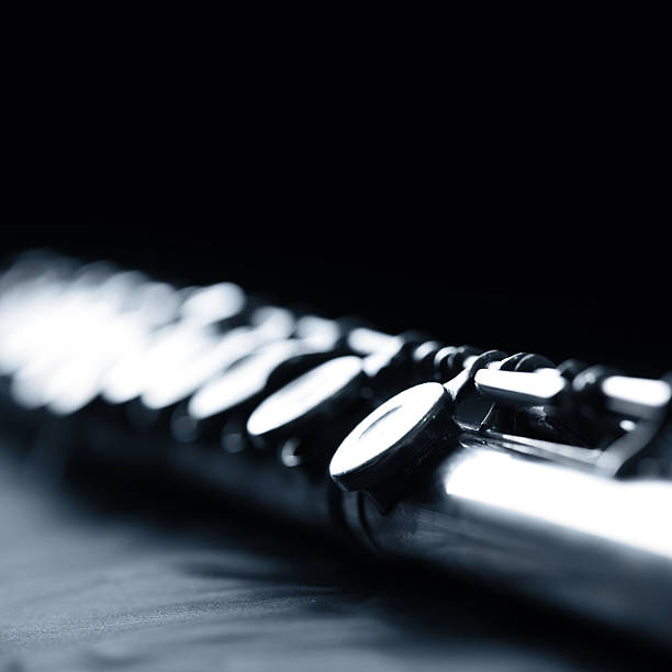 Close-up segment of a flute isolated on white background. Need photos representing music? Please see these... 